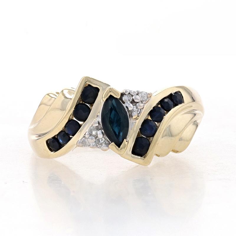 Size: 7
Sizing Fee: Up 2 sizes for $35 or Down 1 size for $35

Metal Content: 10k Yellow Gold & 10k White Gold

Stone Information

Natural Sapphires
Treatment: Heating
Carat(s): .90ctw
Cut: Marquise & Round
Color: Greenish Blue (solitaire) & Blue