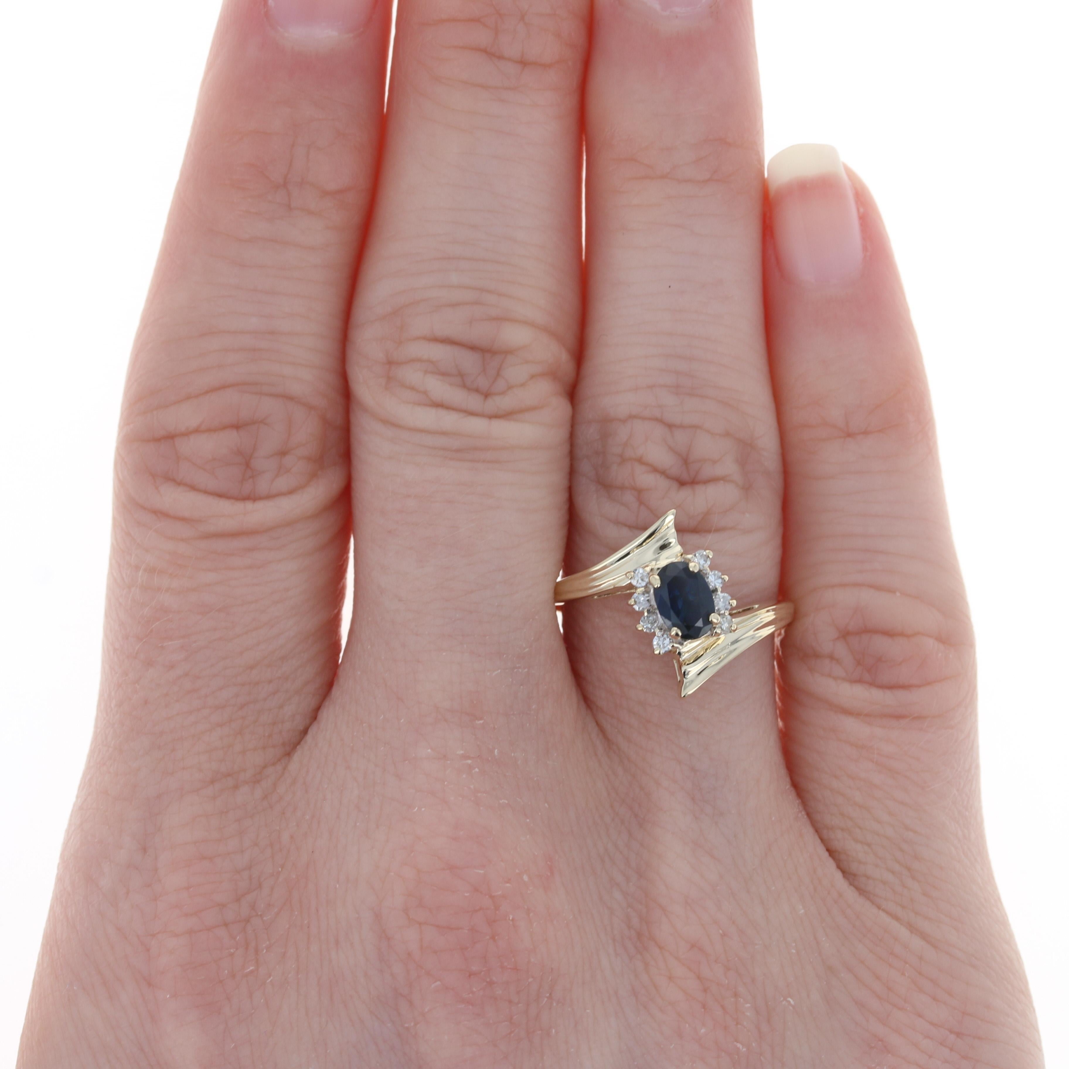 Size: 7 3/4
 Sizing Fee: Up 2 sizes for $25 or Down 3 size for $20
 
 Metal Content: 10k Yellow Gold & 10k White Gold
 
 Stone Information: 
 Genuine Sapphire
 Treatment: Heating
 Carat: .70ct
 Cut: Oval 
 Color: Blue 
 Size: 6mm x 4.2mm
 
 Natural