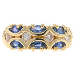 Anillo de oro amarillo con zafiro y diamantes en racimo - 10k Anillo marquesa con festón de 1,02 ctw