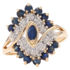 Bague bypass cocktail grappe de saphirs et de diamants en or jaune 14 carats marquise 1,08 carat