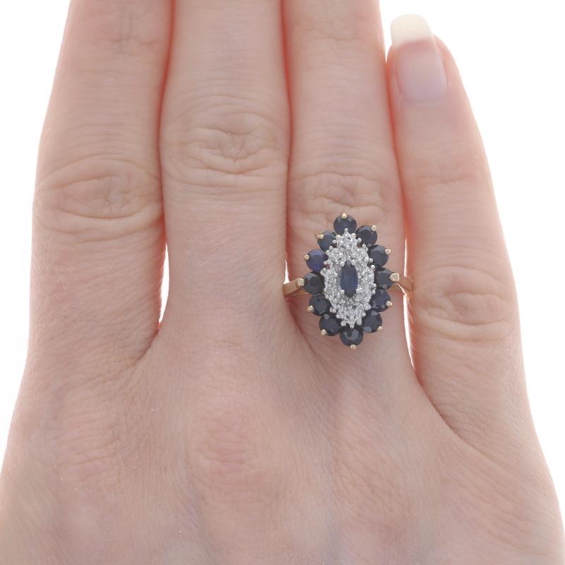 Size: 7
Sizing Fee: Up 3 sizes for $30 or Down 1 1/2 sizes for $20

Metal Content: 10k Yellow Gold & 10k White Gold

Stone Information

Natural Sapphires
Treatment: Heating
Carat(s): 1.95ctw
Cut: Marquise & Round
Color: Blue

Natural
