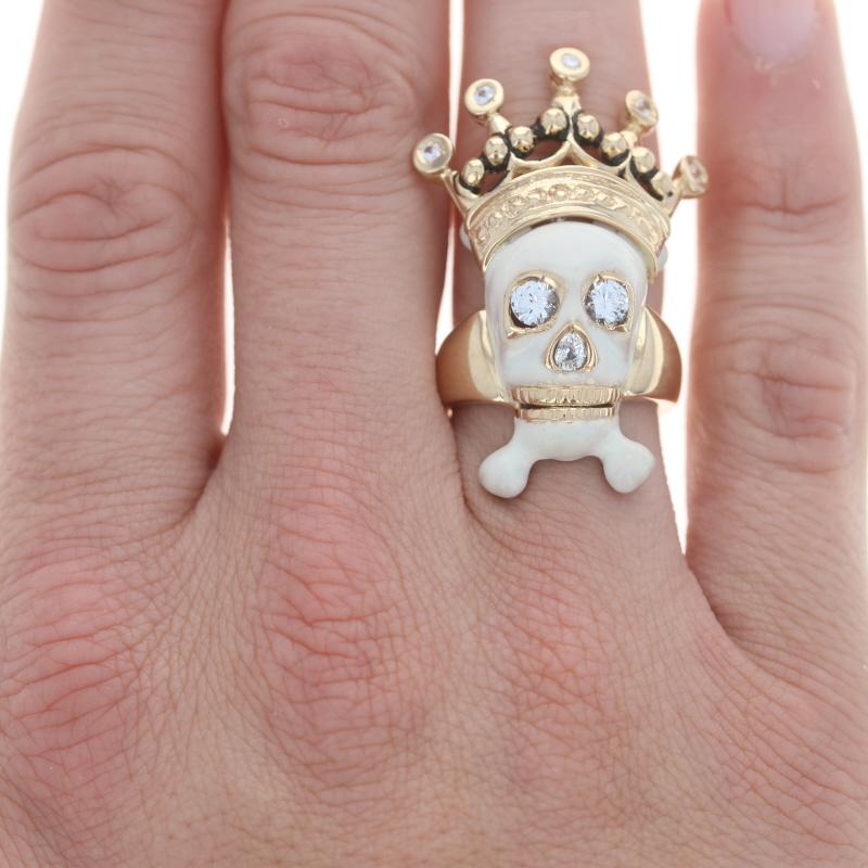 Size: 9

Metal Content: 18k Yellow Gold

Stone Information
Natural White Sapphires
Treatment: Heating
Carat(s): 1.65ctw
Cut: Round & Pear

Natural Diamond
Carat(s): .04ct
Cut: Round Brilliant
Color: G
Clarity: SI2
Stone Note: (top center