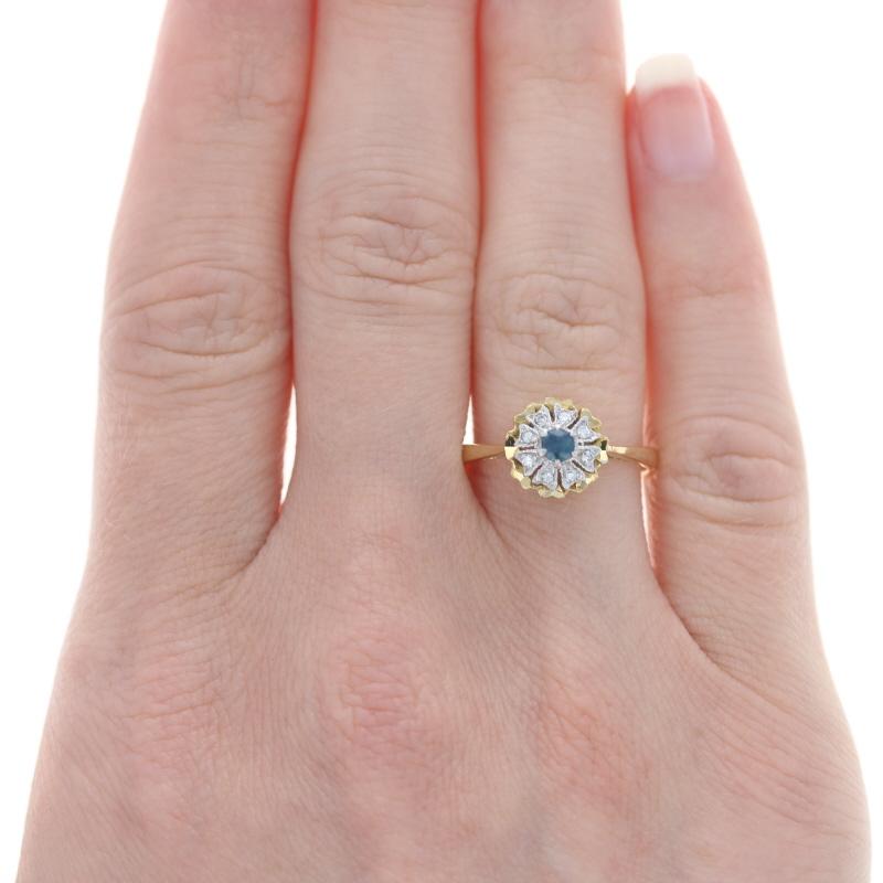 Size: 7
Sizing Fee: Down 3 sizes for $35 or Up 2 sizes for $40

Metal Content: 18k Yellow Gold & 18k White Gold

Stone Information
Genuine Sapphire
Treatment: Heating
Carat: .18ct
Cut: Round
Color: Blue

Natural Diamonds
Carats: .08ctw
Cut: