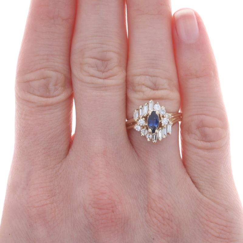 Size: 5
Sizing Fee: Up 2 sizes for $40 or Down 2 sizes for $35

Metal Content: 14k Yellow Gold

Stone Information

Natural Sapphire
Treatment: Heating
Carat(s): .51ct (weighed)
Cut: Marquise
Color: Blue

Natural Diamonds
Carat(s): .72ctw
Cut: Round