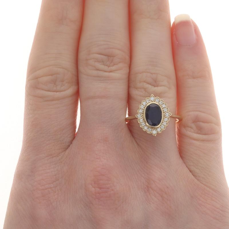 Size: 8 1/4
Sizing Fee: Up 3 sizes for $35 or Down 3 sizes for $30

Metal Content: 14k Yellow Gold

Stone Information

Natural Sapphire
Treatment: Heating
Carat(s): 1.00ct
Cut: Oval
Color: Blue

Natural Diamonds
Carat(s): .16ctw
Cut: Round