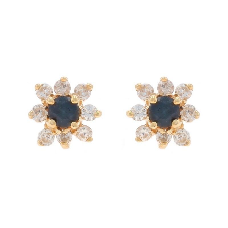 Contenido de metal: Oro amarillo de 14 quilates

Información sobre Stone

Zafiros naturales
Tratamiento: Calentamiento
Quilate(s): .20ctw
Corte: Redonda
Color: Azul

Diamantes naturales
Quilate(s): .16ctw
Talla: Redondo brillante
Color: I -