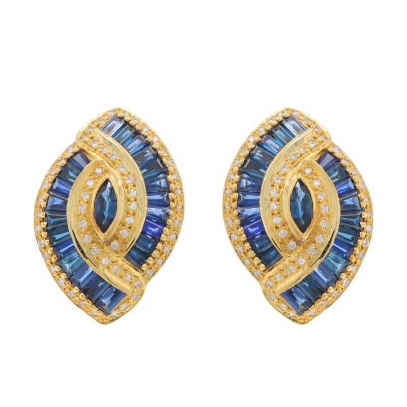 Metal Content: 18k Yellow Gold

Stone Information

Natural Sapphires
Treatment: Heating
Carat(s): 3.48ctw
Cut: Baguette & Marquise
Color: Blue

Natural Diamonds
Carat(s): .22ctw
Cut: Round Brilliant
Color: E - F
Clarity: VS1 - VS2

Total Carats: