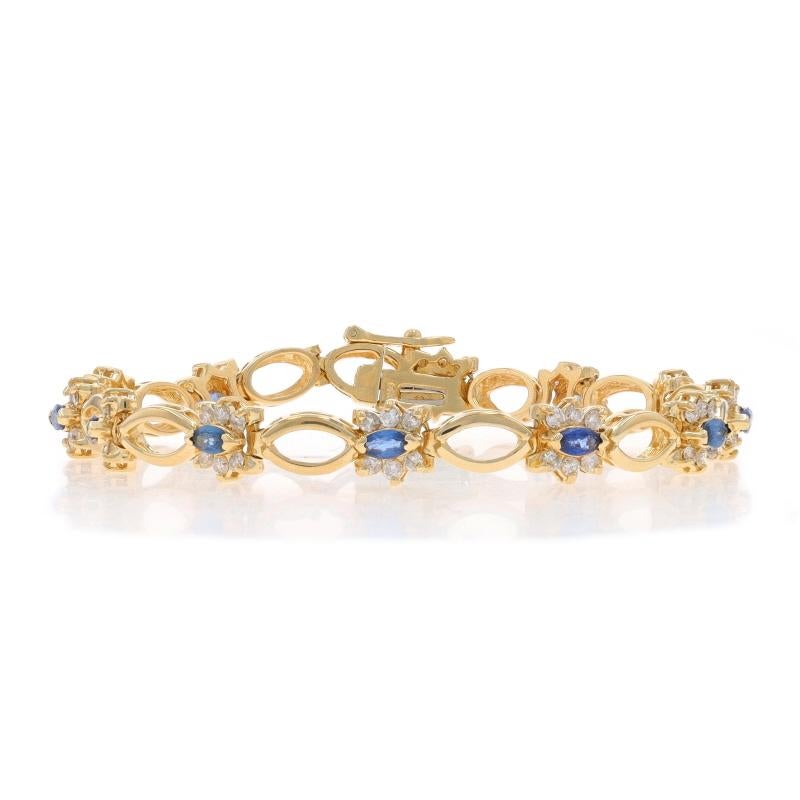 Metal Content: 14k Yellow Gold

Stone Information

Natural Sapphires
Treatment: Heating
Carat(s): 1.56ctw
Cut: Marquise
Color: Blue

Natural Diamonds
Carat(s): 1.44ctw
Cut: Round Brilliant
Color: G - H
Clarity: SI1 - I1

Total Carats: