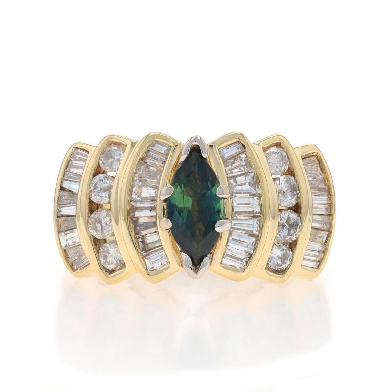 Taille : 6

Contenu métallique : Or jaune 14k et or blanc 14k

Informations sur les pierres

Saphir naturel
Traitement : Chauffage
Carat(s) : .71ct
Coupe : Marquise
Couleur : bleu verdâtre

Diamants naturels
Carat(s) : .64ctw
Taille : Baguette &
