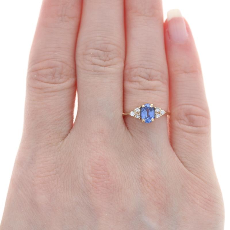 Size: 5 1/2
Sizing Fee: Down 2 size for $30 or up 2 sizes for $35

Metal Content: 14k Yellow Gold

Stone Information
Natural Sapphire
Treatment: Heating
Carat: .94ct
Cut: Oval
Color: Blue
Size: 6.9mm x 5mm

Natural Diamonds
Carats: .12ctw
Cut: