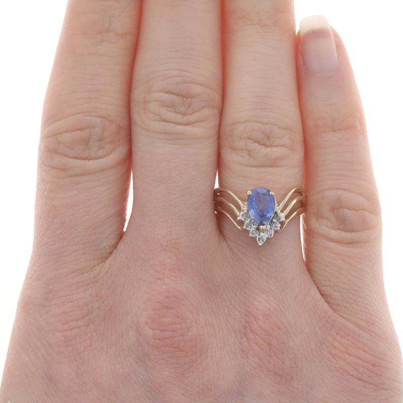 Size: 6 1/2
Sizing Fee: Up 2 sizes for $35 or Down 2 sizes for $30

Metal Content: 14k Yellow Gold & 14k White Gold

Stone Information

Natural Sapphire
Treatment: Heating
Carat(s): 1.10ct
Cut: Pear
Color: Blue

Natural Diamonds
Carat(s):