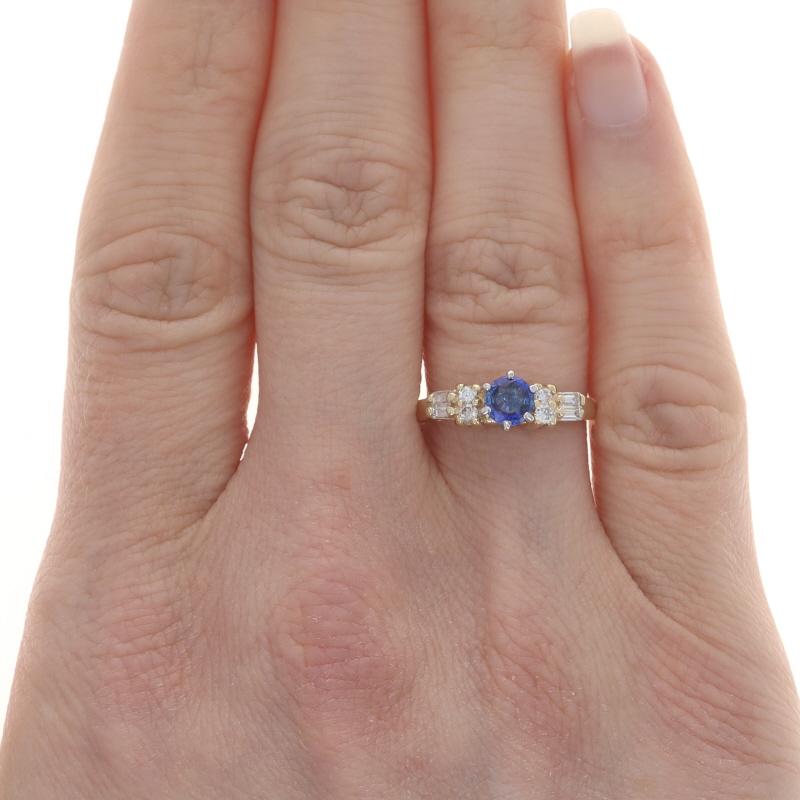 Size: 6 1/4
Sizing Fee: Up 2 sizes for $35 or Down 1 size for $35

Metal Content: 14k Yellow Gold & 14k White Gold

Stone Information

Natural Sapphire
Treatment: Heating
Carat(s): .43ct
Cut: Round
Color: Blue

Natural Diamonds
Carat(s): .24ctw
Cut: