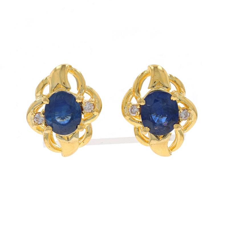 Metal Content: 18k Yellow Gold

Stone Information
Natural Sapphires
Treatment: Heating
Carat(s): 1.60ctw
Cut: Oval
Color: Blue

Natural Diamonds
Carat(s): .06ctw
Cut: Round Brilliant
Color: G - H
Clarity: VS2 - SI1

Total Carats: 1.66ctw

Style: