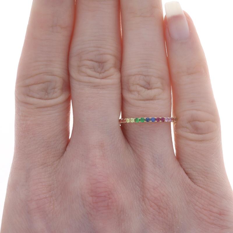 Size: 6 3/4
Note: Please contact us for a resizing quote.

Metal Content: 14k Yellow Gold

Stone Information
Natural Sapphires
Treatment: Heating
Carat(s): .48ctw
Cut: Round
Color: Blue, Green, Red, Pink, Orange, & Yellow

Total Carats: