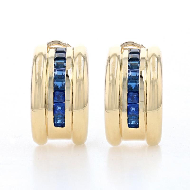 Metal Content: 14k Yellow Gold

Stone Information

Natural Sapphires
Treatment: Heating
Carat(s): 2.40ctw
Cut: Square
Color: Blue

Total Carats: 2.40ctw

Style: J- Hoop
Fastening Type: Omega Closures

Measurements

Tall: 7/8