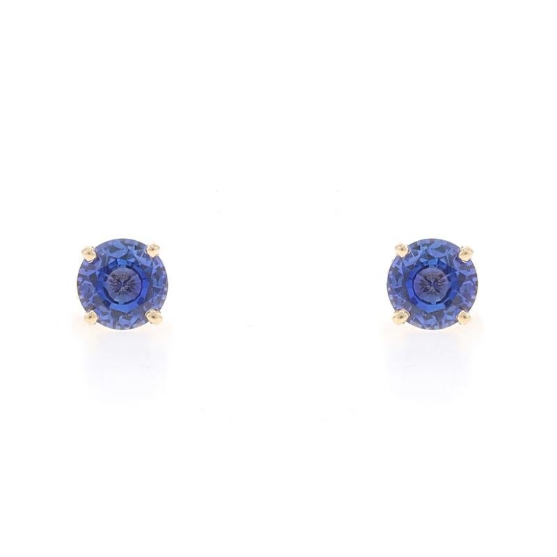 Metal Content: 14k Yellow Gold

Stone Information

Natural Sapphires
Treatment: Heating
Carat(s): 1.83ctw
Cut: Round
Color: Purplish Blue
Size: 5.9mm

Total Carats: 1.83ctw

Style: Stud
Fastening Type: Butterfly Closures

Measurements

Diameter: