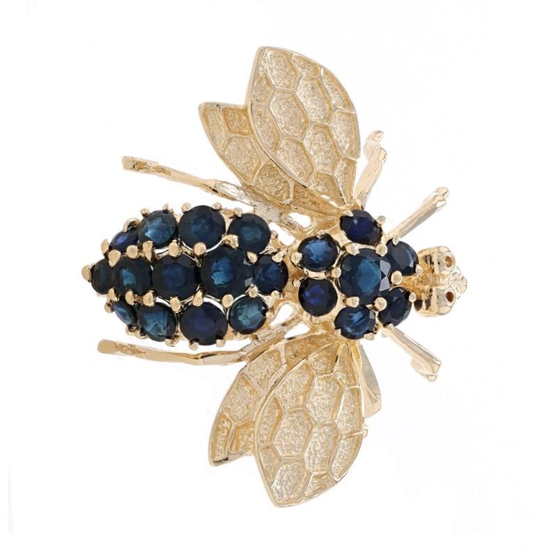 Era: Vintage

Metal Content: 14k Yellow Gold

Stone Information

Natural Sapphires
Treatment: Heating
Carat(s): 2.40ctw
Cut: Round
Color: Dark Blue

Total Carats: 2.40ctw

Style: Brooch/Pendant
Fastening Type: Hinged Pin and Whale Tail Bullet