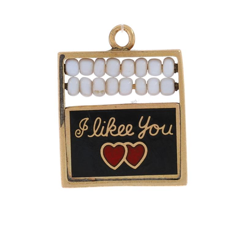 Metal Content: 14k Yellow Gold

Material Information
Beads
Color: White

Enamel
Color: Red & Black

Theme: School Sweethearts, Abacus Chalkboard Counting Frame

Measurements
Tall (from stationary bail): 3/4