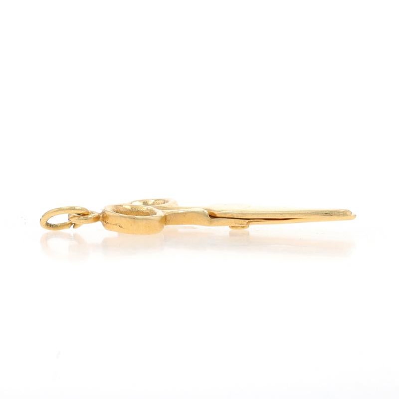 Metal Content: 14k Yellow Gold

Theme: Scissors, Office, Arts & Crafts Schools Supplies
Features: The scissors can open and close.

Measurements

Tall (from stationary bail): 1 1/8
