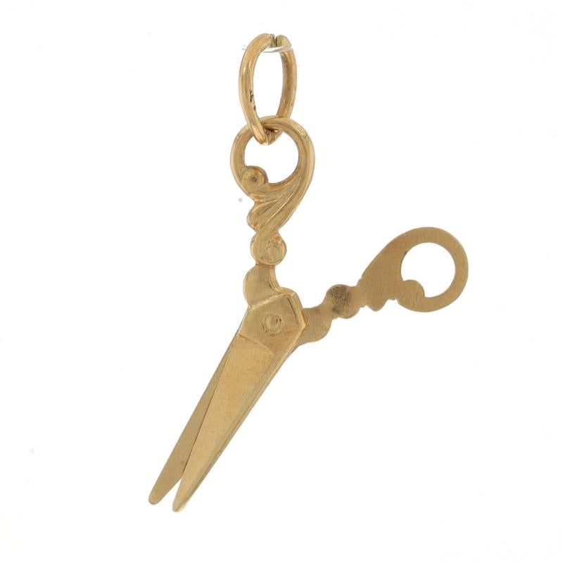 Metal Content: 14k Yellow Gold

Theme: Scissors, Office School Arts & Crafts Tool
Features: The scissors remain in a fixed, slightly open position.

Measurements

Tall (from stationary bail): 31/32