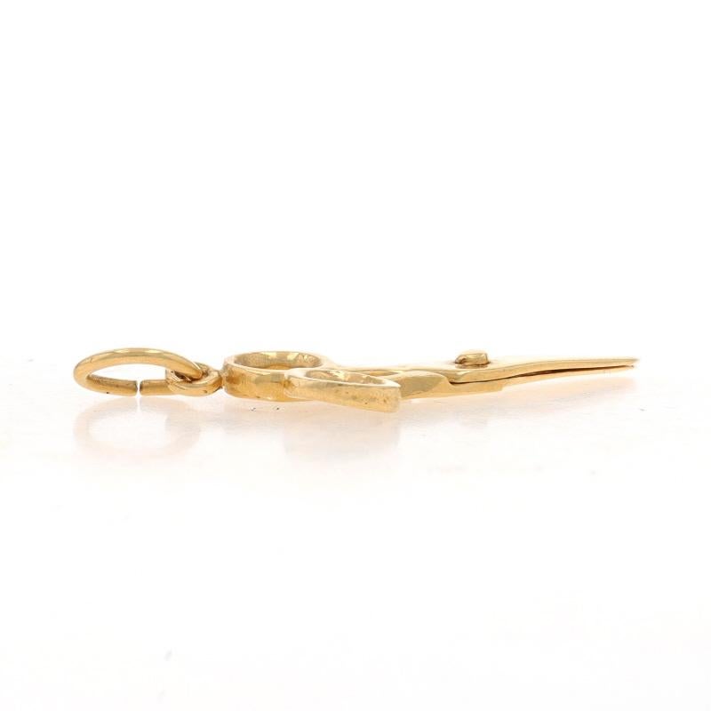 Metal Content: 14k Yellow Gold

Theme: Scissors, School Arts & Crafts Office Supplies
Features: The scissors can open and close.

Measurements
Tall (from stationary bail): 1 1/8