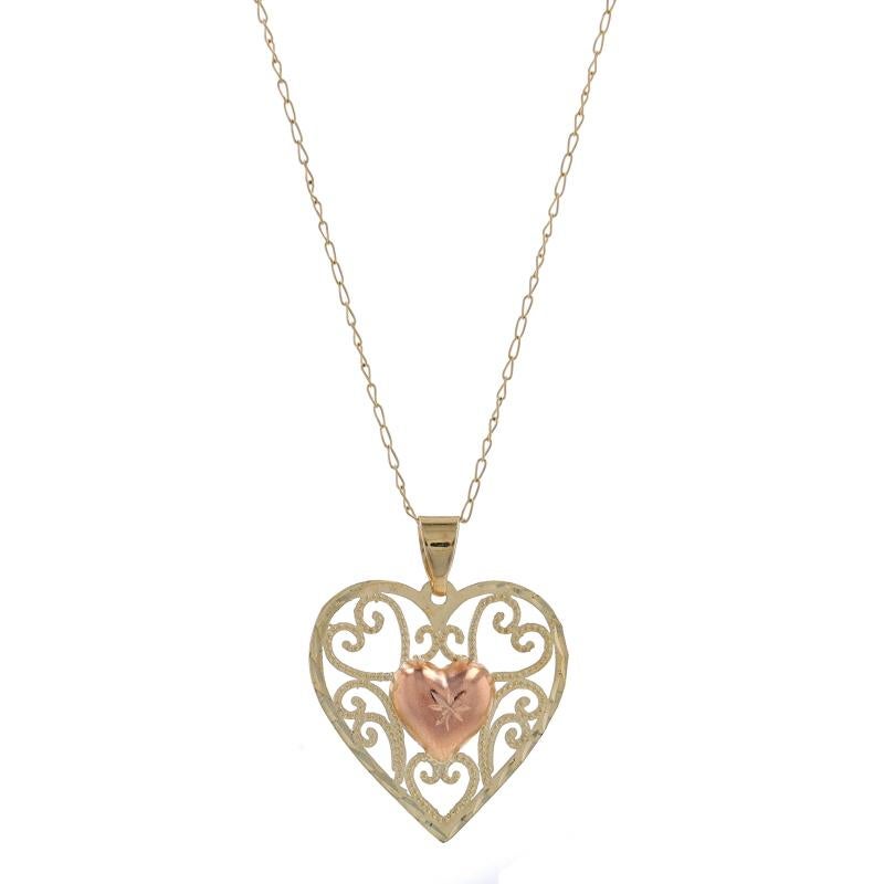 Metal Content: 10k Yellow Gold & 10k Rose Gold (pendant) with 14k Yellow Gold (necklace)

Chain Style: Curb
Necklace Style: Chain
Fastening Type: Spring Ring Clasp
Theme: Scrollwork Heart, Love
Features: Open Cut Design with Etched & Milgrain