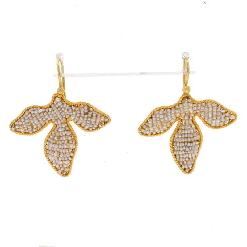 Metal Content: 22k Yellow Gold

Stone Information
Natural Seed Pearls
Color: White

Style: Drop
Fastening Type: Fishhook Closures with Safety Latches
Theme: Botanical, Leaves

Measurements
Tall: 1 7/16