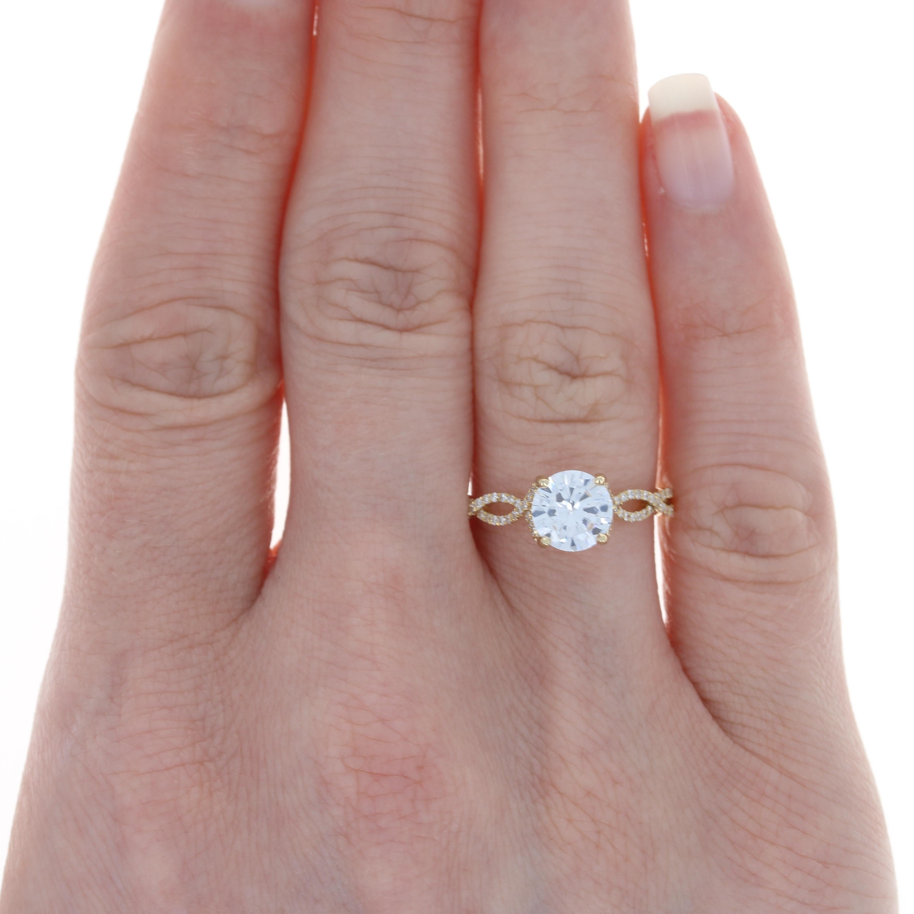 Size: 6 
Sizing Fee: Up 2 sizes for $80 or Down 1 size for $60 

Metal Content: 14k Yellow Gold  

Stone Information: 
Cubic Zirconia (placeholder solitaire) 
Diameter: 6.9mm 

Natural Diamond Accents
Total Carats: .39ctw
Cut: Round Brilliant