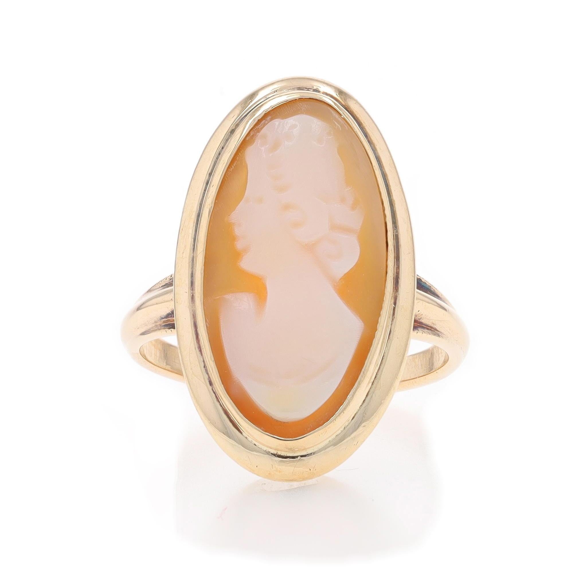 Size: 4 1/4
Sizing Fee: Up 3 sizes for $30 or Down 1 1/2 sizes for $30

Era: Vintage

Metal Content: 10k Yellow Gold

Stone Information

Natural Shell
Cut: Carved Cameo
Size: (approximately) 17.7mm x 9.3mm

Style: Cocktail Solitaire
Theme: