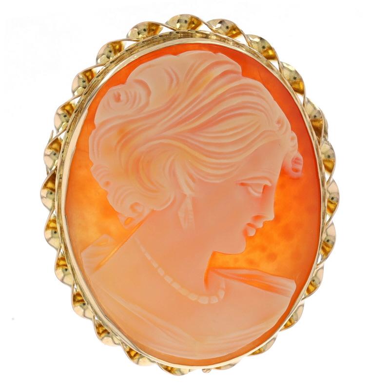 Era: Vintage

Metal Content: 14k Yellow Gold

Stone Information

Natural Shell
Cut: Carved Cameo
Size: (approx.) 29mm x 22.8mm

Style: Convertible Brooch/Pendant
Fastening Type: Hinged Pin and Whale Tail Bullet Clasp
Theme: