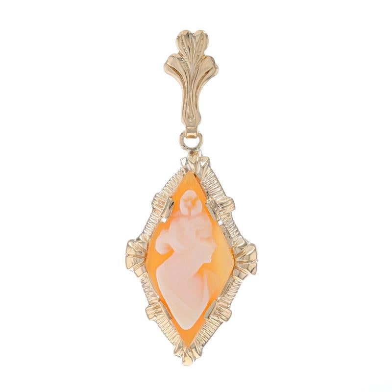 Era: Vintage

Metal Content: 10k Yellow Gold

Stone Information
Natural Shell
Cut: Carved Cameo
Size: 18.1mm x 8.9mm

Theme: Silhouette

Measurements
Tall (from stationary bail): 31/32