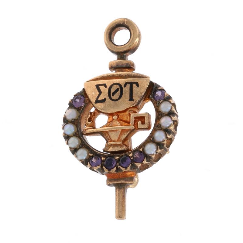 Fraternity: Sigma Theta Tau Nursing Honor Society
Fraternity Founding Date: 1922

Metal Content: 10k Yellow Gold

Stone Information
Natural Amethysts
Cut: Round
Color: Purple

Natural Seed Pearls

Material Information
Enamel
Color: Black

Style: Key