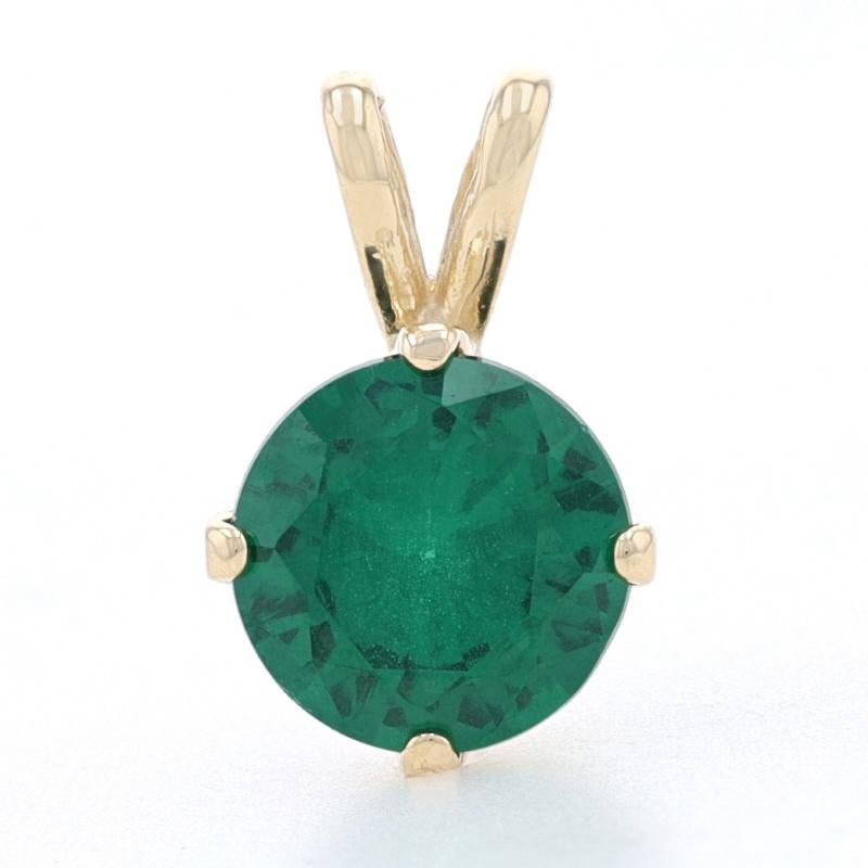 Metal Content: 14k Yellow Gold

Stone Information

Simulated Emerald
Cut: Round
Color: Green
Size: 7.8mm

Style: Solitaire

Measurements

Tall (from stationary bail): 9/16