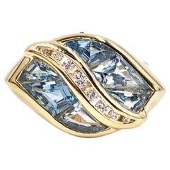 Yellow Gold Sky Blue Topaz and Diamond Modern Ring