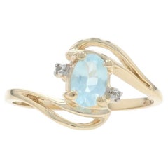 Yellow Gold Sky Blue Topaz Diamond Bypass Ring - 10k Oval .51ctw