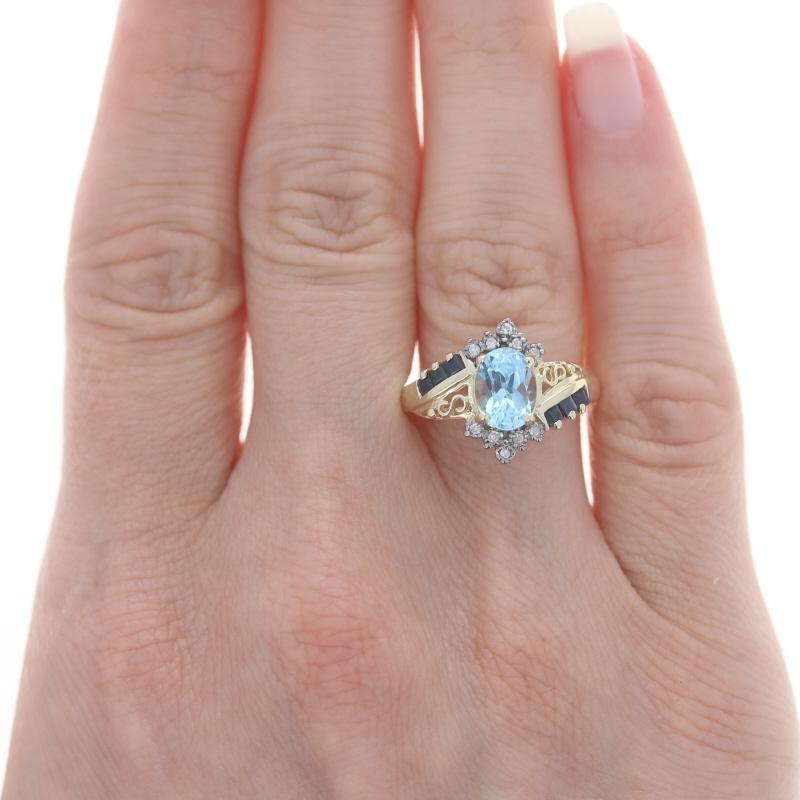 Oval Cut Yellow Gold Sky Blue Topaz, Sapphire, & Diamond Bypass Ring - 10k Oval 2.07ctw For Sale