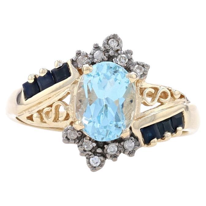 Yellow Gold Sky Blue Topaz, Sapphire, & Diamond Bypass Ring - 10k Oval 2.07ctw For Sale
