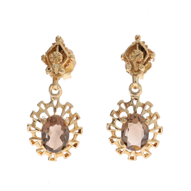 Metal Content: 14k Yellow Gold

Stone Information

Natural Smoky Quartz
Carat(s): 1.70ctw
Cut: Oval
Color: Brown

Total Carats: 1.70ctw

Style: Dangle
Fastening Type: Butterfly Closures
Theme: Floral

Measurements

Tall: 31/32