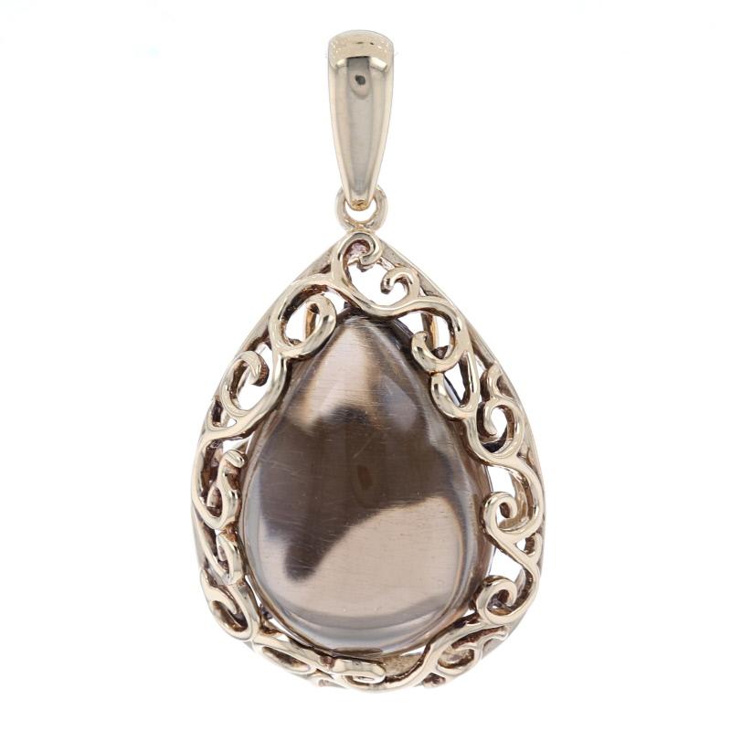 Metal Content: 14k Yellow Gold

Stone Information: 
Natural Smoky Quartz
Carat: 5.50ct
Cut: Pear Cabochon
Color: Brown

Style: Solitaire
Features: Scrollwork Border

Measurements:
Tall (from stationary bail): 13/16