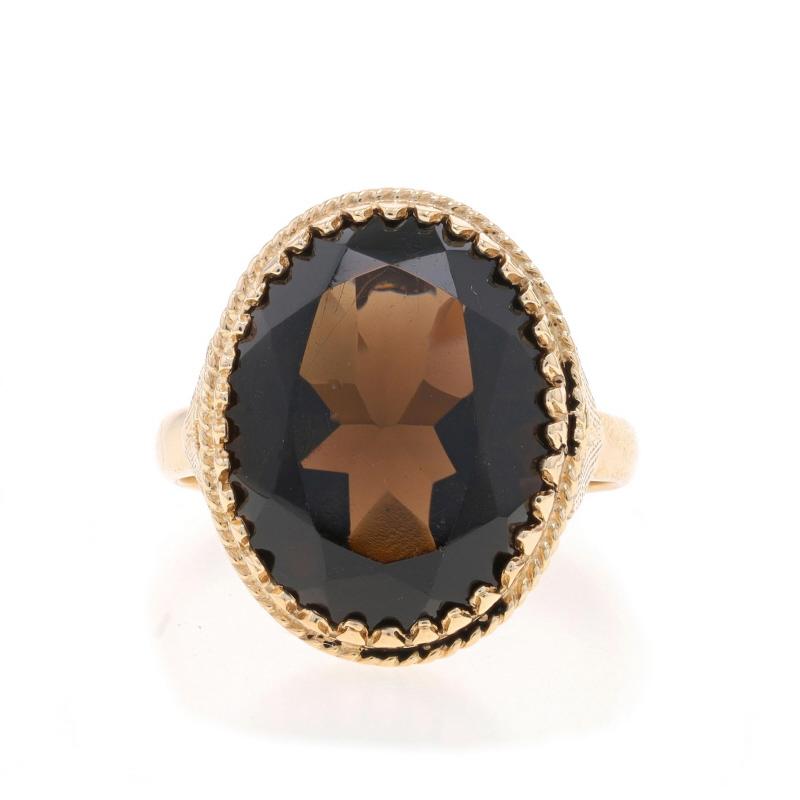 Size: 6 3/4
Sizing Fee: Up 3 sizes for $30 or Down 2 sizes for $30

Era: Vintage

Metal Content: 10k Yellow Gold

Stone Information

Natural Smoky Quartz
Carat(s): 7.60ct
Cut: Oval
Color: Brown

Total Carats: 7.60ct

Style: Cocktail