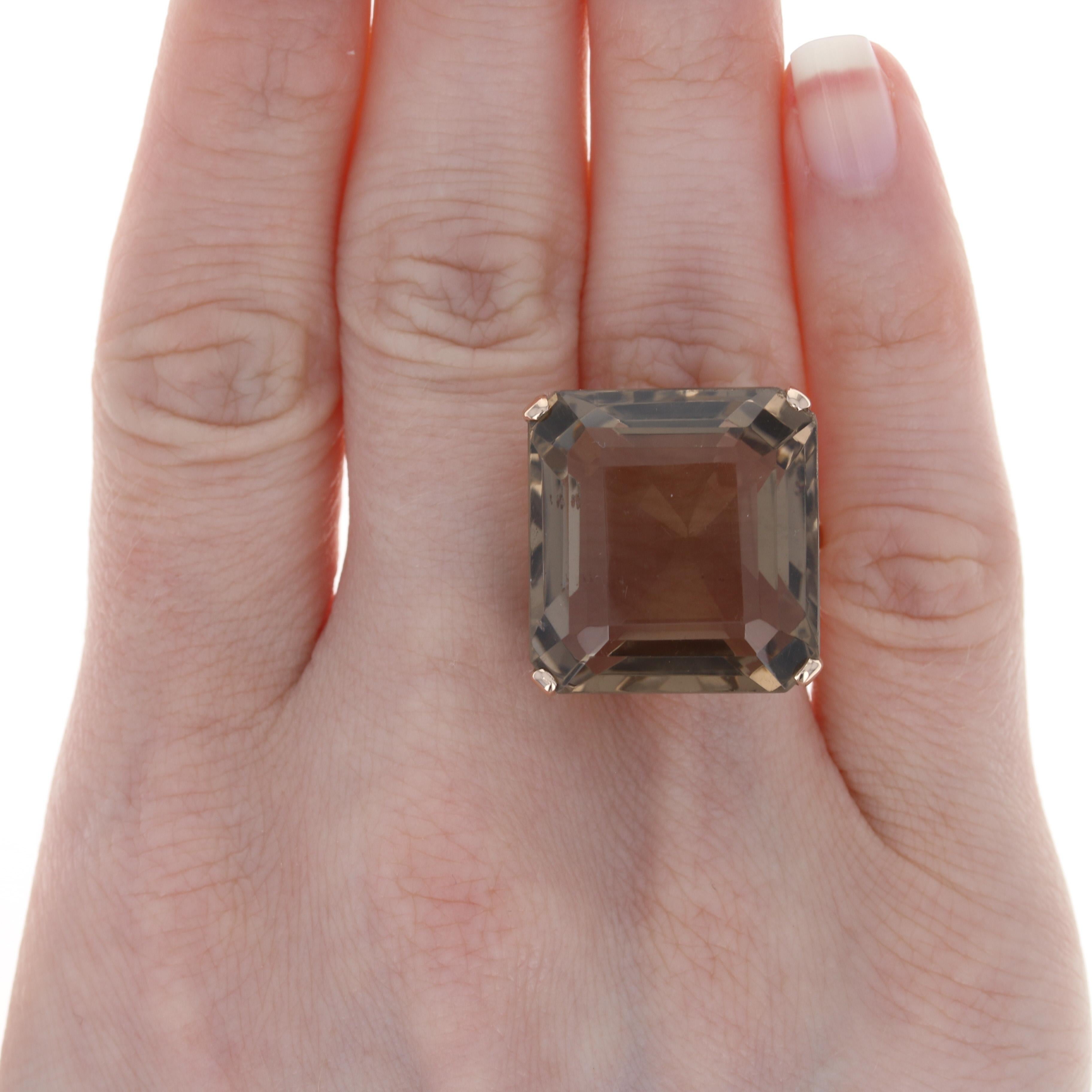 Size: 6 1/4
Sizing Fee: Can be sized down 1 size or up 2 sizes for $30

Era: Vintage

Metal Content: 14k Yellow Gold

Stone Information: 
Genuine Smoky Quartz
Carat: 35.20ct
Color: Brown
Size: 21.3mm x 20.3mm

Style: Cocktail Solitaire

Face Height