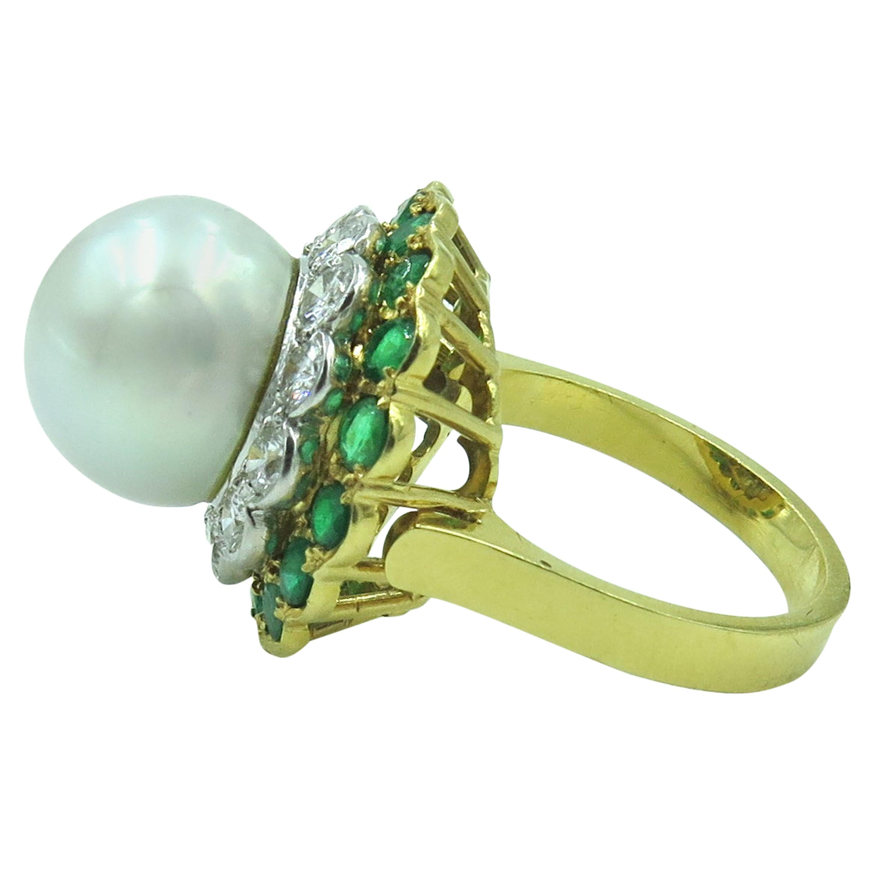 An 18 karat yellow gold, south sea pearl, diamond and emerald ring.  