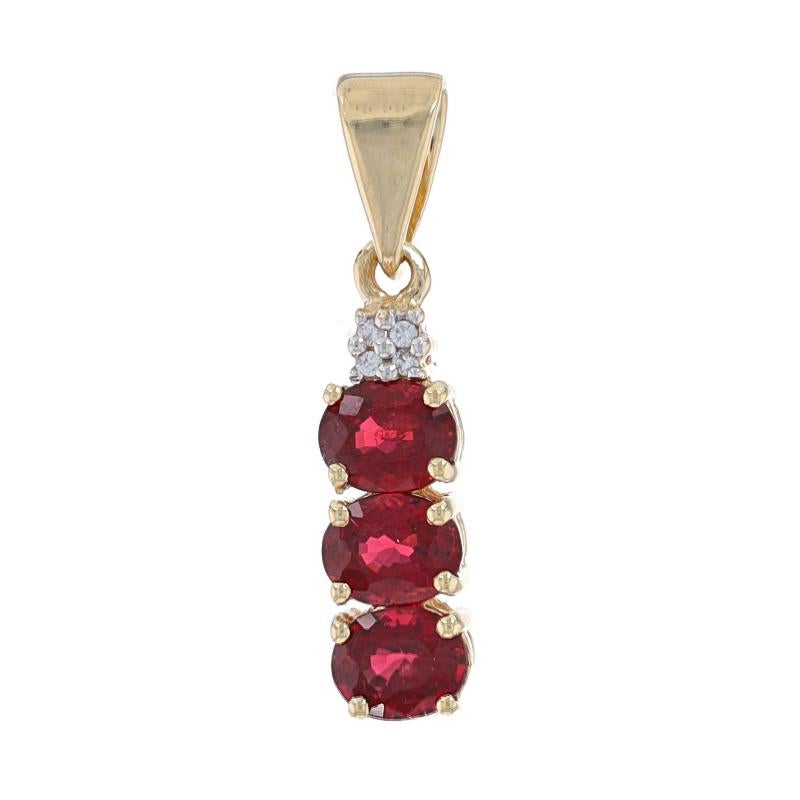 Metal Content: 10k Yellow Gold & 10k White Gold

Stone Information

Natural Spinel
Carat(s): 1.30ctw
Cut: Oval
Color: Red

Natural White Topaz
Carat(s): .04ctw
Cut: Round

Total Carats: 1.34ctw

Style: Three-Stone Journey with Accents
Features: