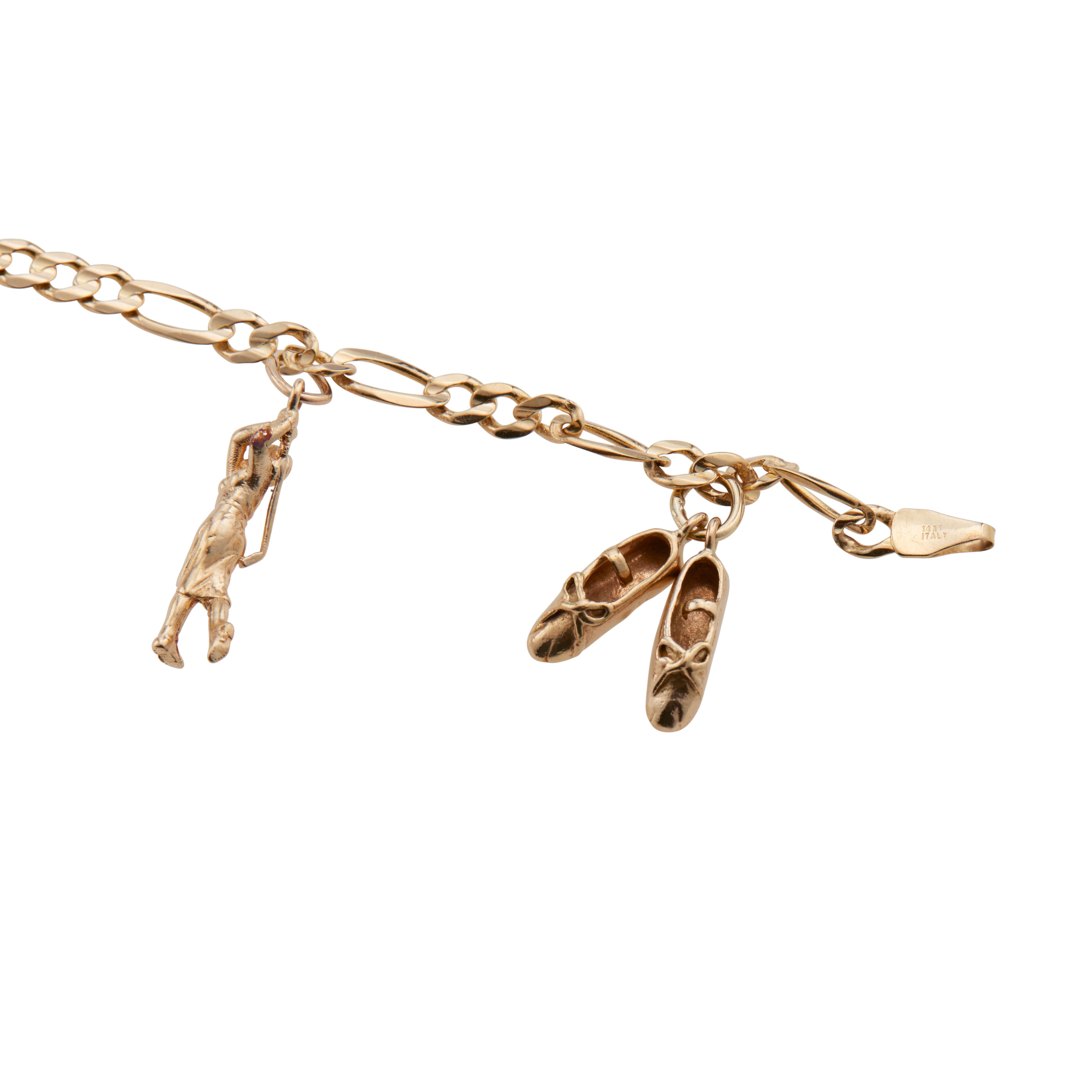 1960's Sport Motif 14k yellow gold charm bracelet. Ballet shoes, lady golfer, bowler, ice skated, riding boot and cap charms. 7.5 inches in length. 

14k yellow gold 
Stamped: 14k
13.6 grams
Bracelet: 7.5 Inches
Width: 3.9mm
Thickness/depth: 1.1mm

