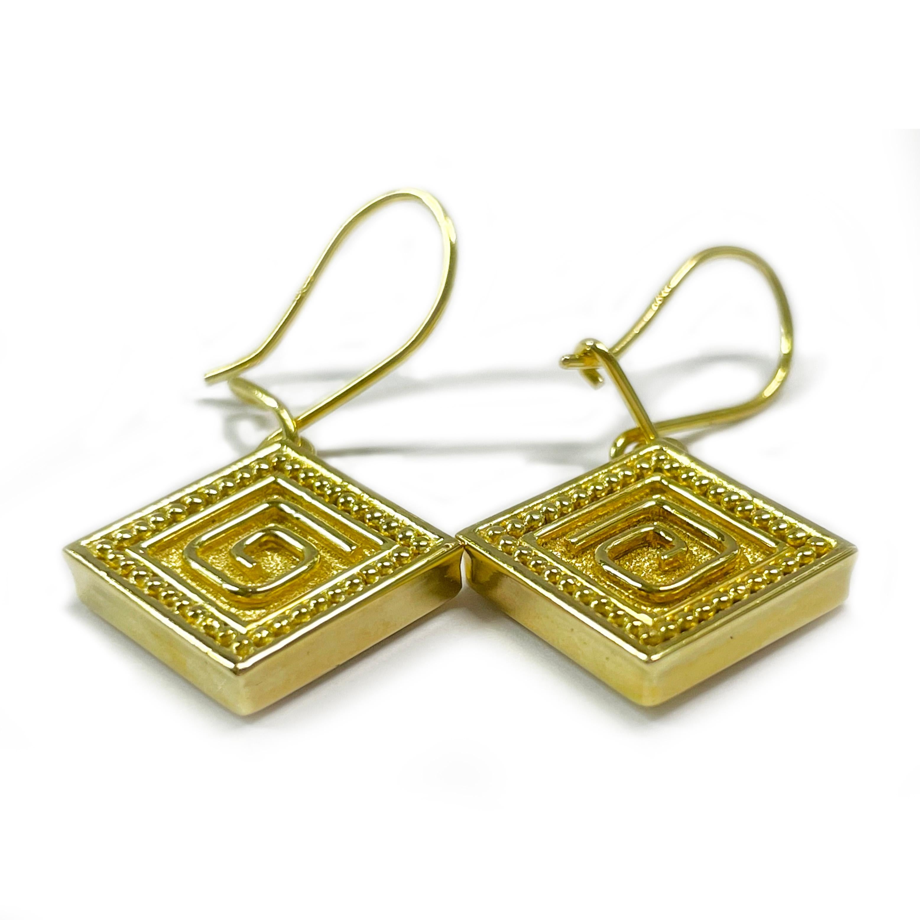 18 Karat Yellow Gold Square Dangle Earrings. The earrings feature a geometric design with gold bead surround and a stone finish. Each earring measures approximately 13.2 x 13.1 mm (not including earwire). Including the earwire the earrings measure