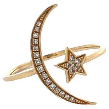 This Diamond Star and Moon Ring is set in 14K Yellow Gold with Twenty-One (21) Round Brilliant Cut Diamonds F-G/SI in Quality weighing 0.08ctw. The ring is currently sized at a 7 but can be resized. 
