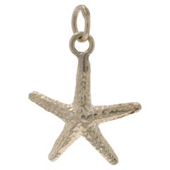 Charm a forma di stella marina in oro giallo 14 carati
