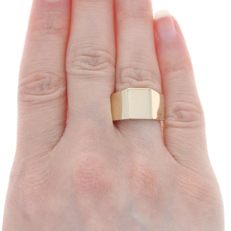 Size: 6 3/4

Metal Content: 14k Yellow Gold

Style: Statement Band
Features:  Angled, tapered Silhouette

Measurements

Face Height (north to south): 15/32