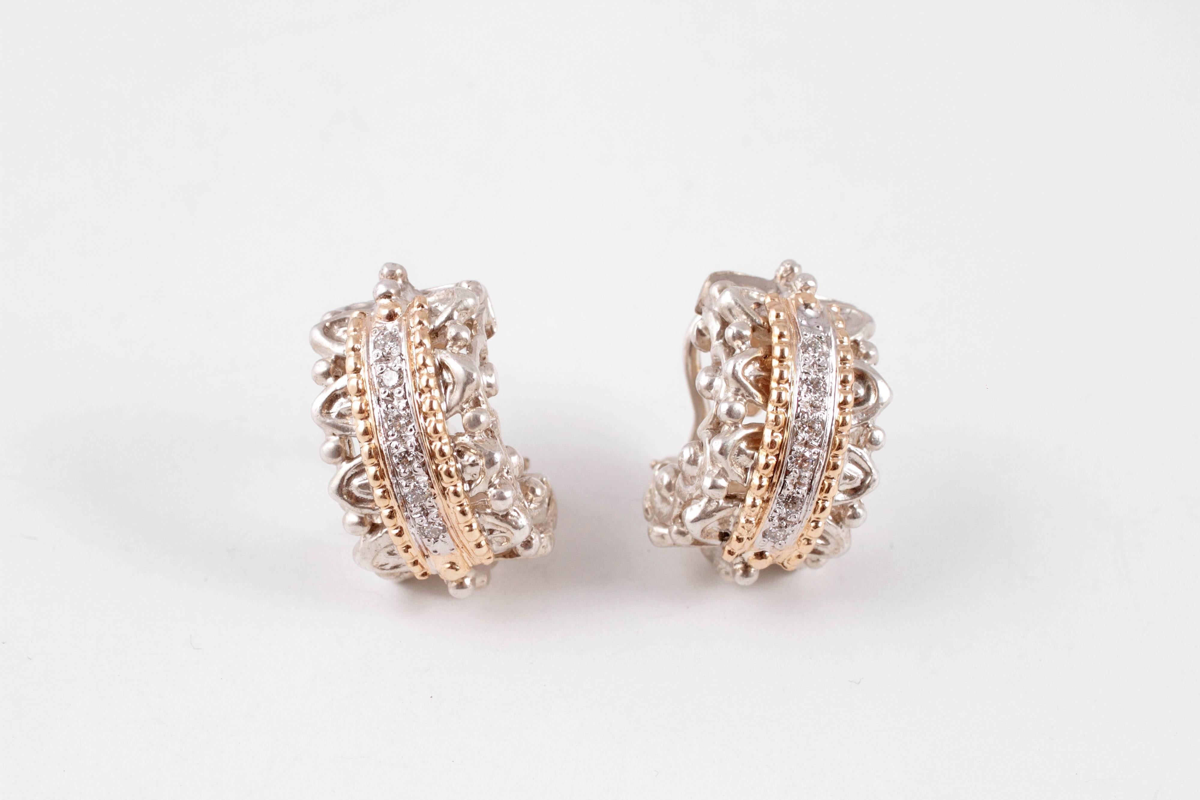 So comfy on the ears!  These 14 karat yellow gold and diamond earrings by Alwand Vahan are in a 1/2 hoop style and are a must have for every collection!