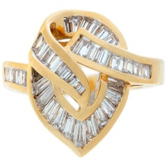 Yellow gold swirl of diamonds ring w/ around 3 carats in baguette diamonds